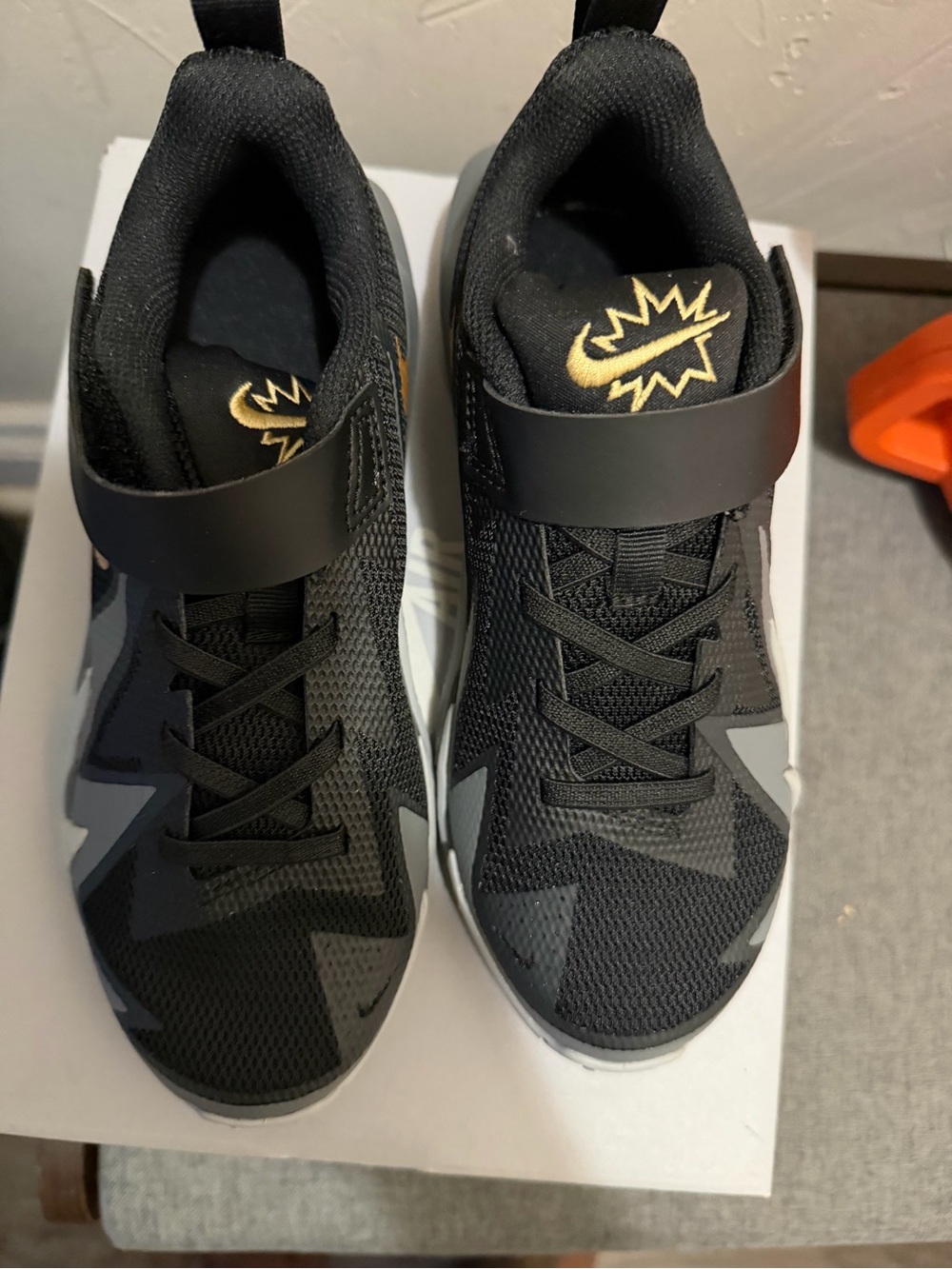 Boys  Black Nike Athletic Sneakers with Gold Accent